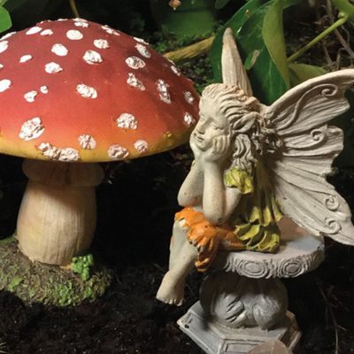 daydreaming fairy on stone